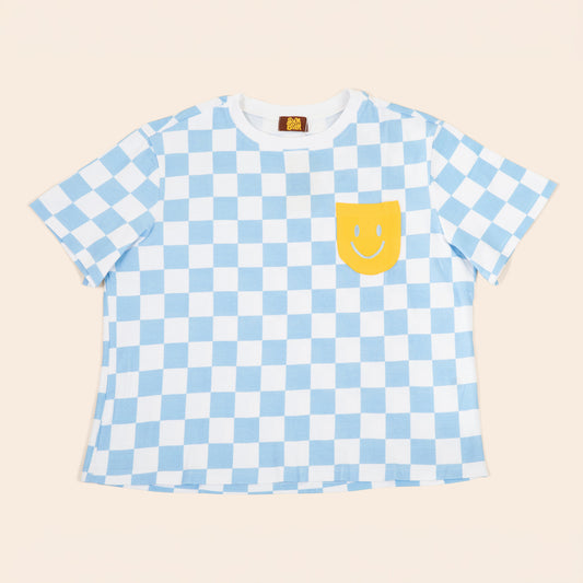 White and blue Checkered t-shirt with a yellow smiley face pocket on a beige background | SUNBEAN
